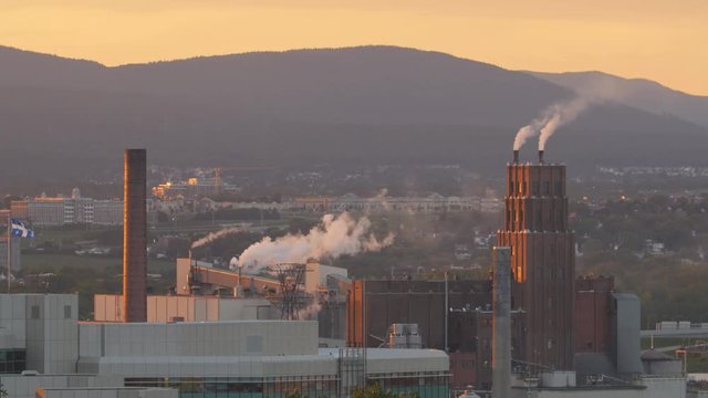 Factory at sunset. Paper mill in Quebec City, Quebec, Canada.