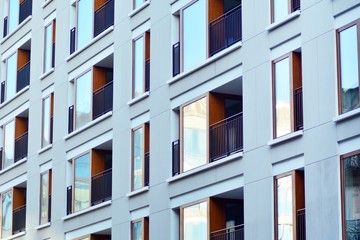 Modern apartment buildings on a sunny day with a blue sky. Facade of a modern apartment building
