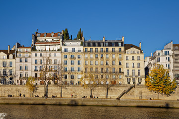 Fototapeta na wymiar Paris, France - November 18, 2018: Haussmann buildings along the bank of river Seine