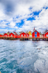 Travel Ideas. Red Fisherman Houses on Lofoten islandsat a Spring Sunny Day