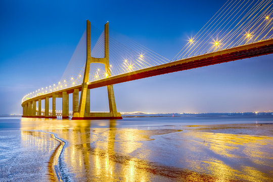 Famous and Renowned Picturesque Vasco Da Gama Bridge in Lisbon in Portugal. Picture Made During Blue Hour.