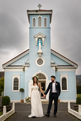 young couple bride groom getting married wedding posed photos at seaside sea beach hairpiece...