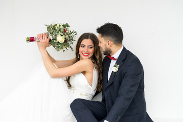 young couple bride groom getting married wedding posed photos at seaside sea beach hairpiece...