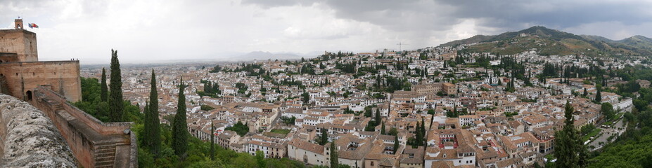 Fototapeta na wymiar Panorama of beautiful white buildings in the historic city center of Albaicin in Granada, Spain