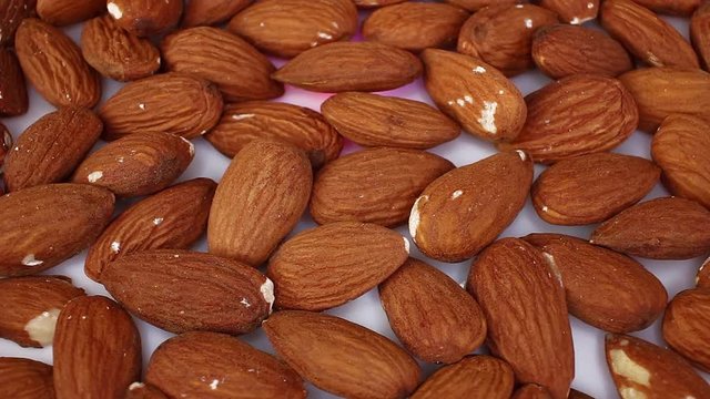 Almond raw whole almonds nut nuts looping texture pattern closeup video