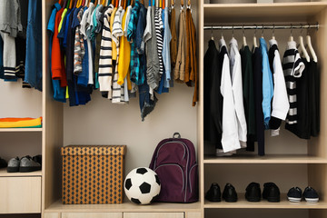 Obraz premium Large wardrobe with teenager clothes, shoes and accessories