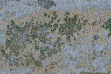 stone texture on a gray concrete wall with shabby colored paint