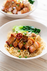 egg noodle soup with crispy pork belly and wonton