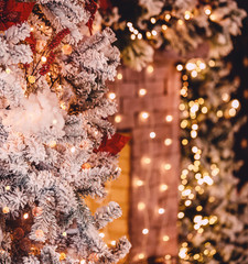 Christmas tree background and Christmas decorations with snow, blurred, sparking, glowing. Happy New Year and Xmas theme
