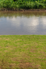 Green lawn near river
