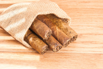 cigar of tobacco on the wooden background