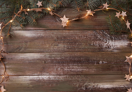 Wooden background with christmas decorations. Flat lay.
