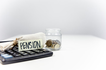 retirement fund concept - money and a calculator