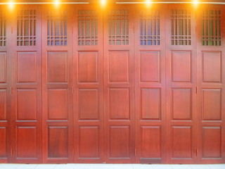 Chinese style door. Brown wood door knob.
