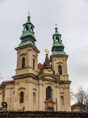 Fototapeta na wymiar Ancient Church with green domes, Prague, Czech Republic