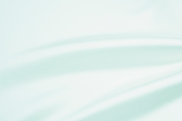 The texture of the satin fabric of blue color for the background