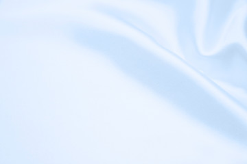 The texture of the satin fabric of blue color for the background