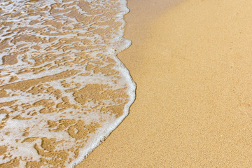 waves brush sands at beach