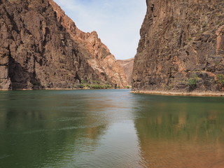 Fototapeta na wymiar A placid stretch of the Colorado River just above Granite Rapids in Grand Canyon National Park, Arizona.
