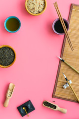 Chinese traditional symbols concept. Tea, rice, hieroglyph love, bambootabe mat, chopsticks, soy...