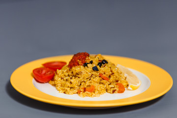 a portion of ready-made pilaf of raw and African rice with slices of carrots and barberry
