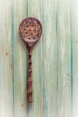 wooden spoon on green timber table top
