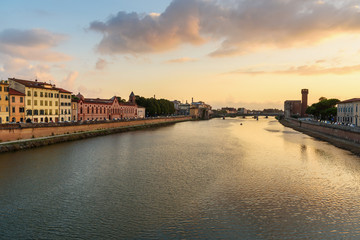 Obraz premium View on embankment of Arno river at sunset. Pisa, Italy
