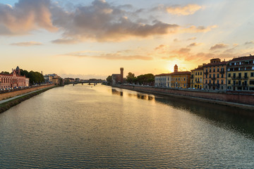 Fototapeta premium View on embankment of Arno river at sunset. Pisa, Italy
