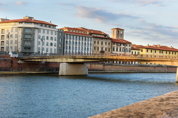 Naklejka premium View on embankment of Arno river and Solferino bridge. Pisa, Italy