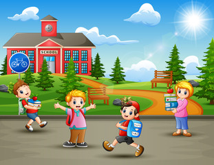 Happy school children in the road to school