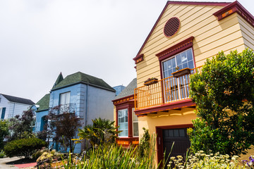 Fototapeta na wymiar Street view of rows of houses in one of the San Francisco's residential neighborhoods, California