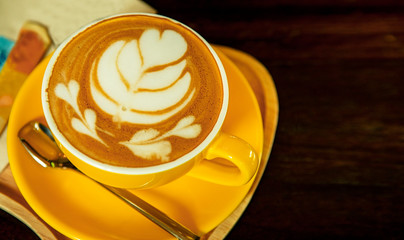 top view of dressing of black hot coffee cup ready to drink on wood table 