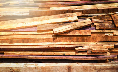pile of old wood plank remnant from construction / pile used timber planks