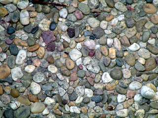 colored pebbles in sand