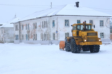 snowplow clearing roads of snow. tractor remove snow from city