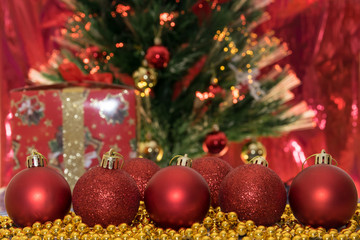 Christmas decorations, red balls on a red background.