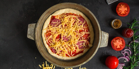 pizza, dough, ingredients, pepperoni, cheese, toatny sauce (cooking process). Top view with copy space
