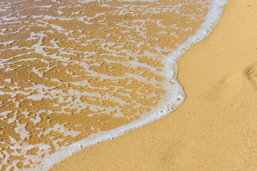 pure sands and clear sea water at the beach in summer 