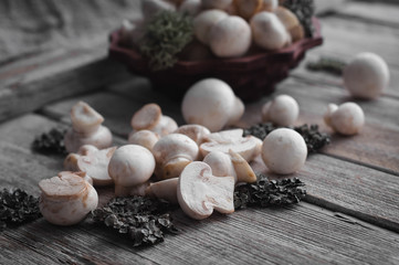 white mushrooms on a wooden table