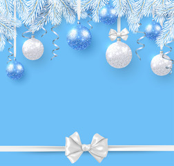 Christmas and New Year background with white fir branches, Christmas balls and satin bow.