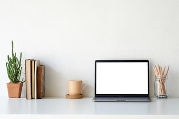 Workplace mockup concept. Mock up home decoration laptop and office supply with copy space for products display montage.