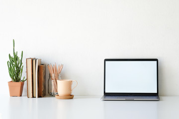 Workplace mockup concept. Mock up home decoration laptop and office supply with copy space for products display montage.