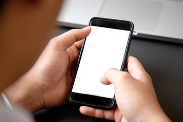 Cropped shot businessman in suit using mockup smartphone.