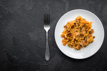 cabbage stew, lentils, spices, vegetables (braised cabbage). vegetarian food.  top view. copy space