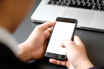 Cropped shot businessman in suit using mockup smartphone.