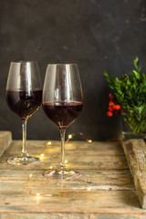 wine, red wine, transparent glass on a wooden table, a gift. Top view. copy space