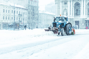 snowplow at city center cleaning of snow