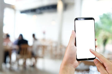 Cropped shot hands using mockup smartphone with clipping path.