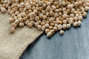 Chickpeas are on the wooden background