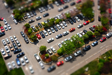 dense parking lot in tilt shift effect in top view © xb100